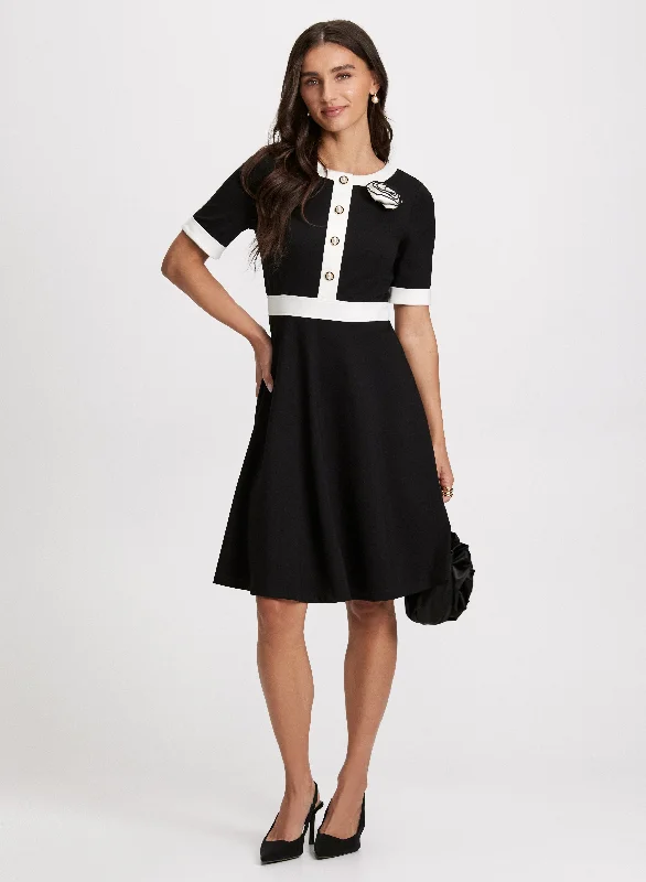 Midi dresses with ruffled sleeves for a more feminine and voluminous lookRosette Embellished Knit Dress