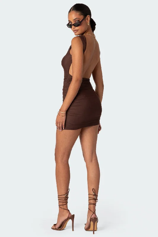 Mini dresses with criss - cross backs for a flirty lookMikey Ruched Open Back Mini Dress